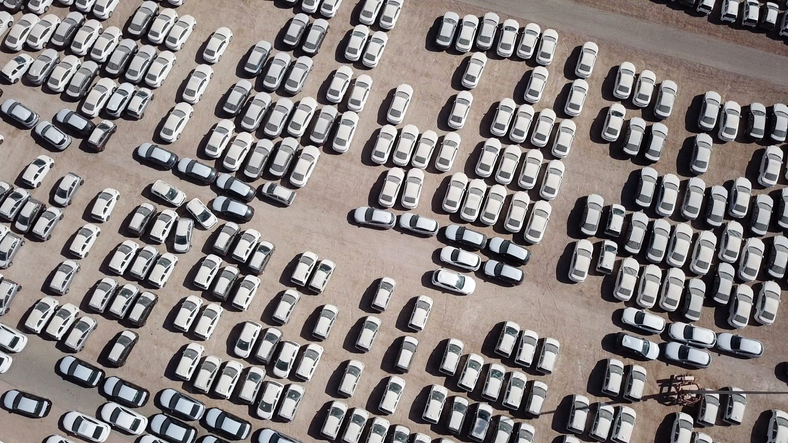 New cars parked in a holding platform