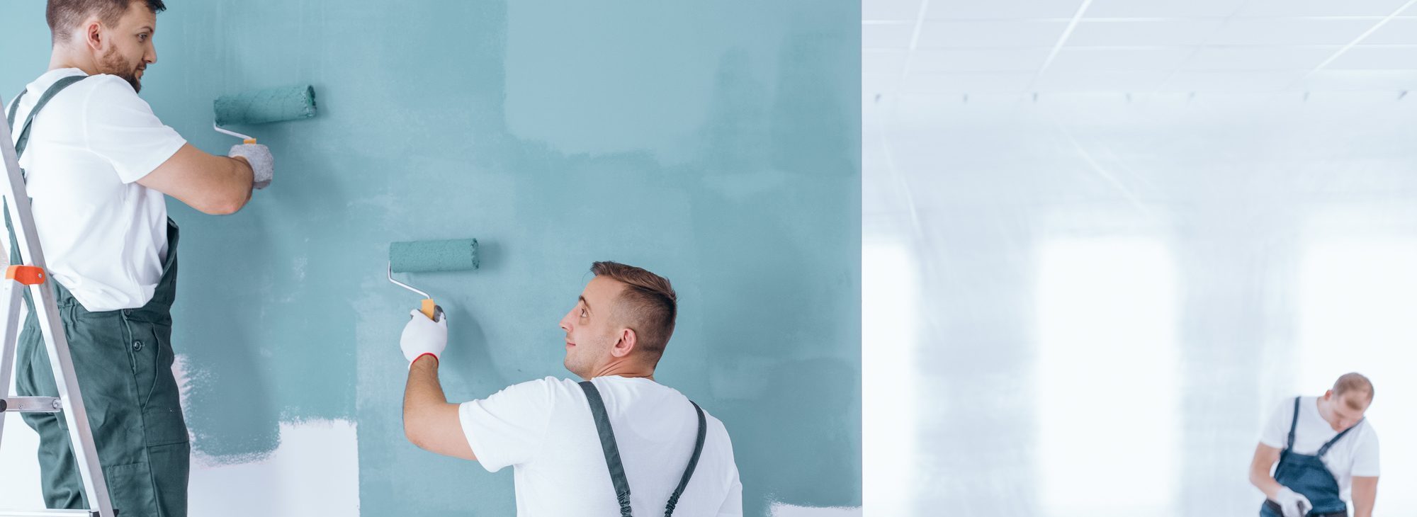 Men painting empty home interior